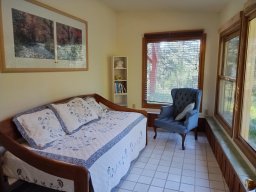 Ground floor sunroom-bedroom across the Chapel